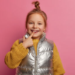little-girl-pointing-at-tooth-256x256 